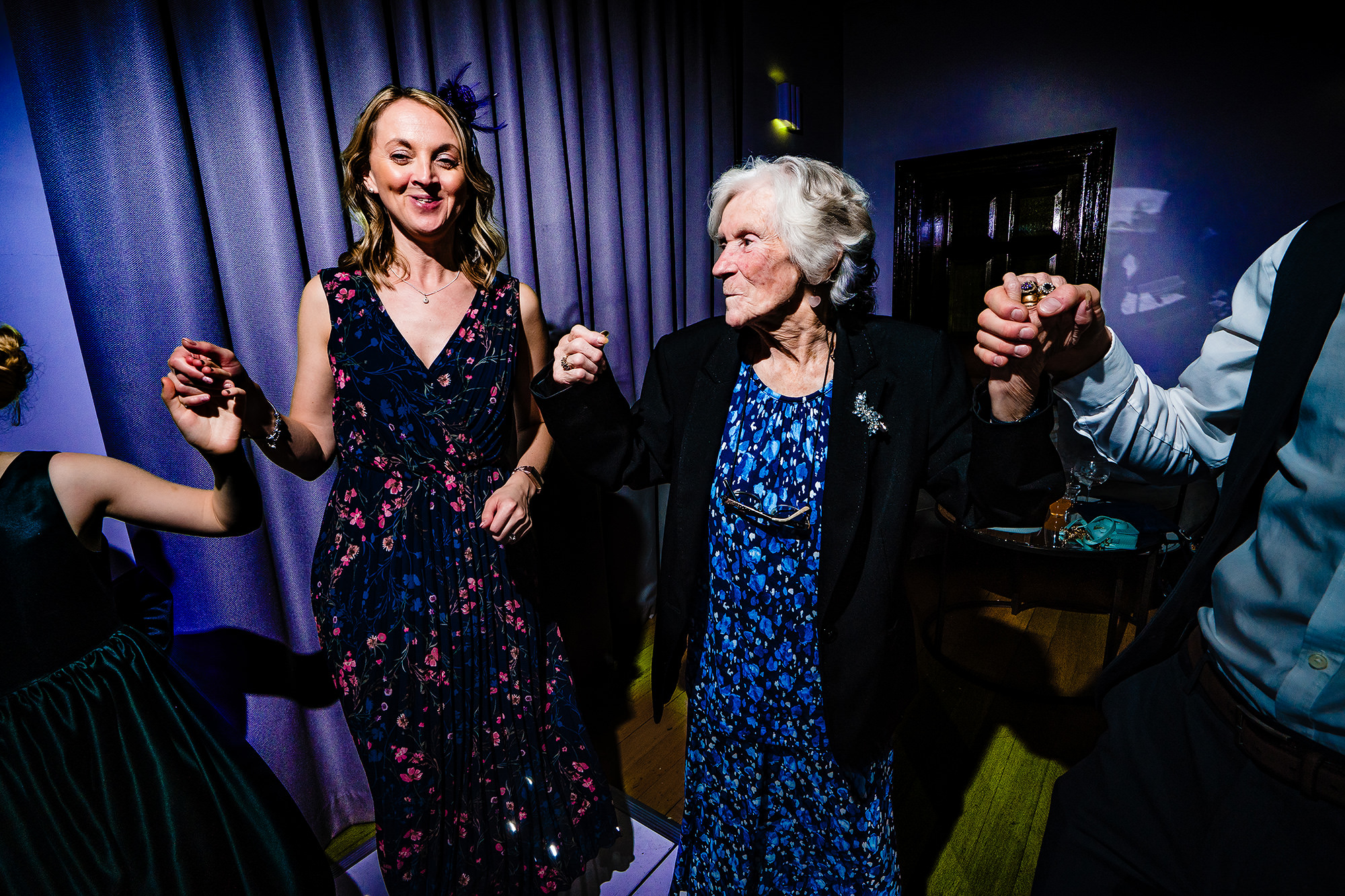 Three generations of the same family dancing together at Salt House