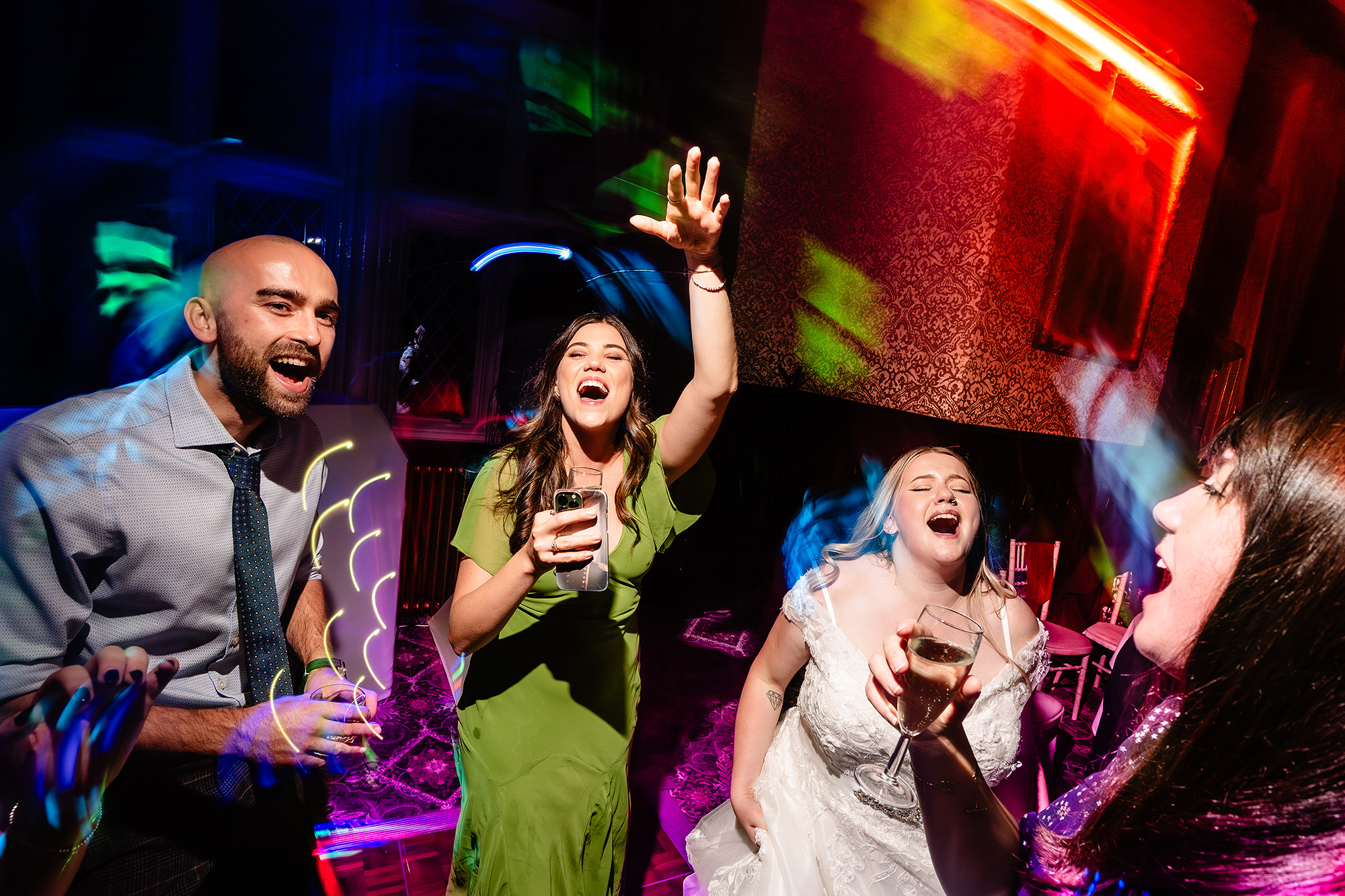 More guests singing and dancing as the party goes on into the night at Crewe Hall, Cheshire wedding photographer