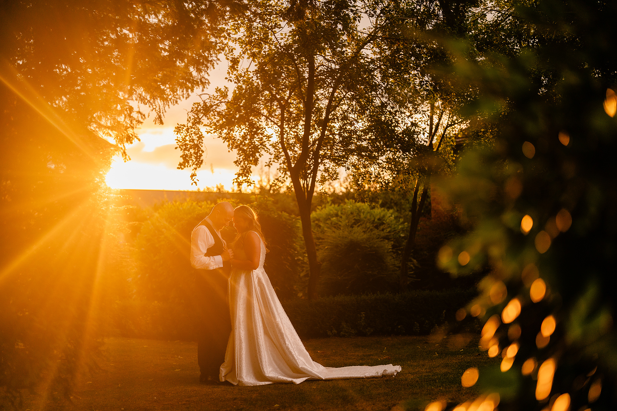 Chloe and Pete walking off together into a golden Cheshire sunset