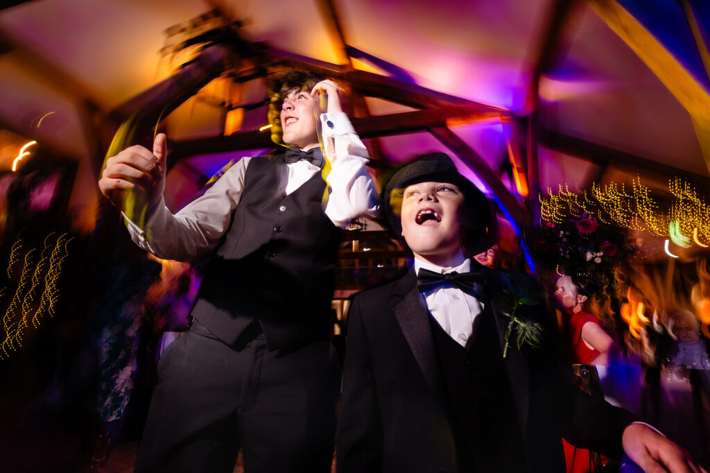 Two boys dancing with colourful motion blur, Nottingham wedding photographer