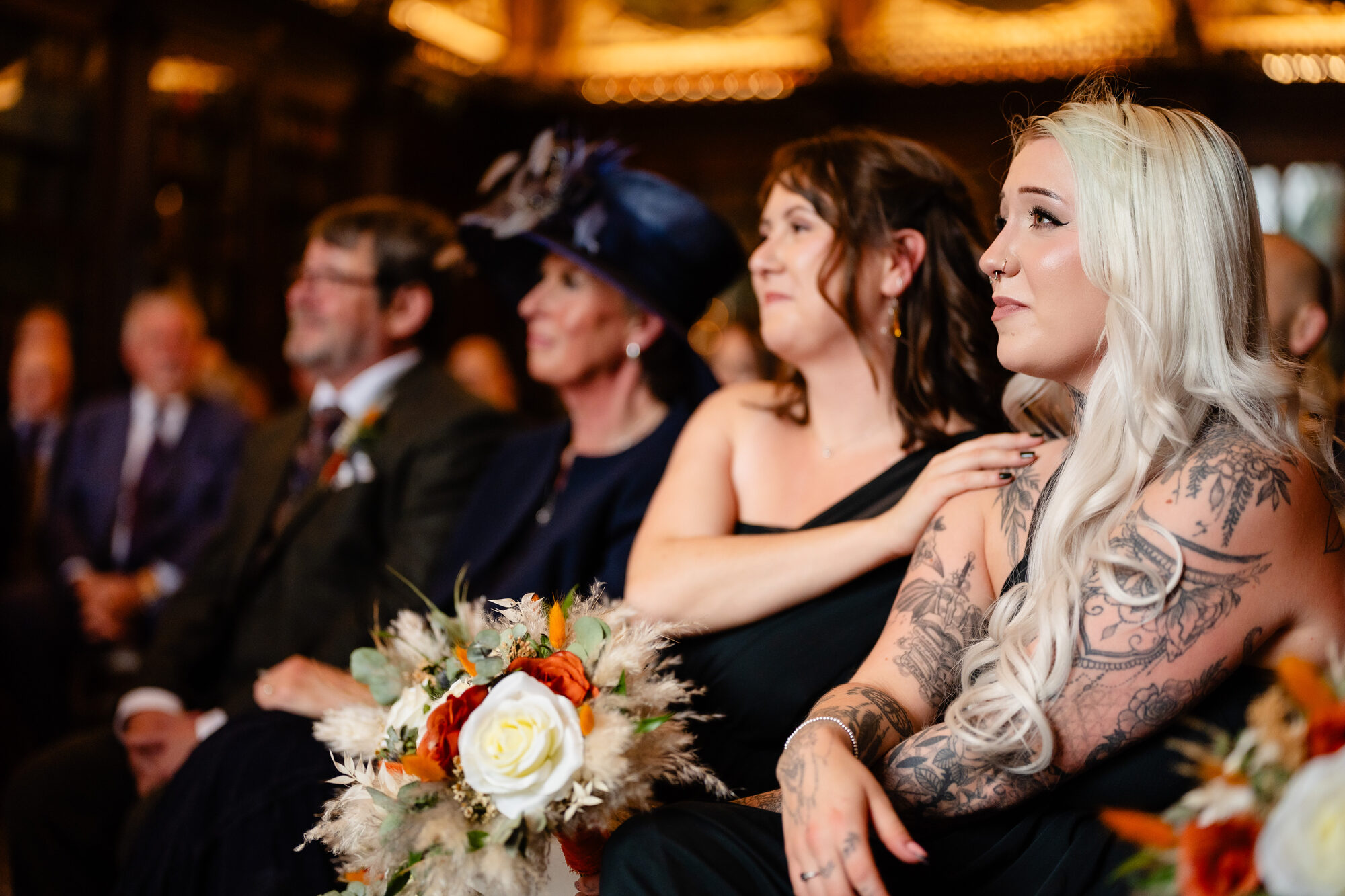 Bride with her father at a candlelit wedding ceremony