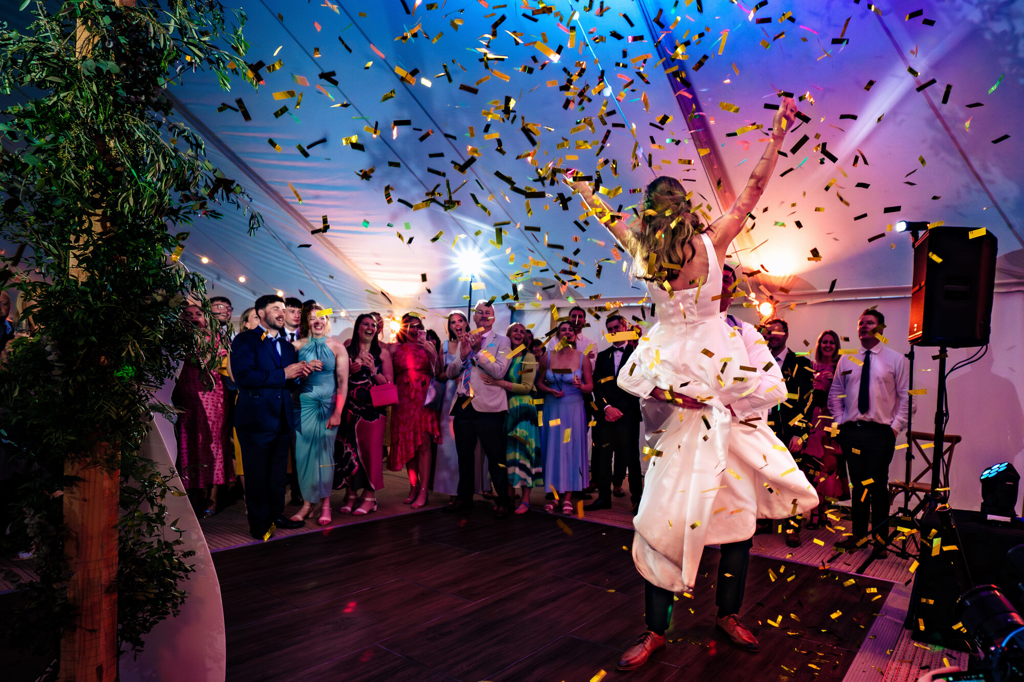 Confetti cannon going off over the couple's first dance