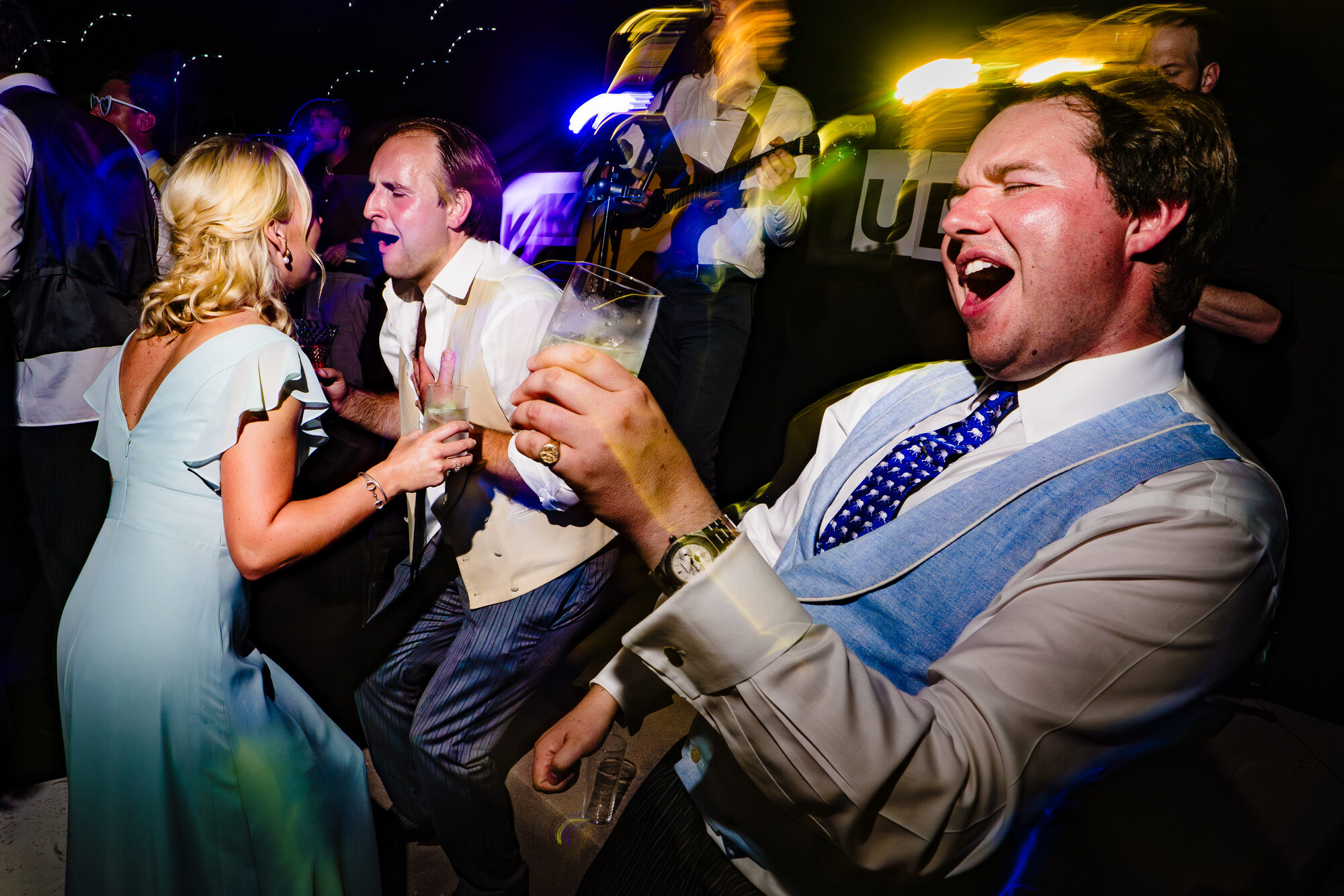 Guests singing along together at the evening reception