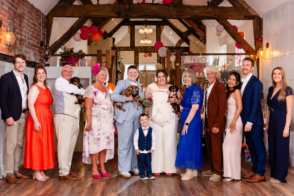 Family group photo with Marianne, Emma and their two sausage dogs inside The Hidden Barn @ 94