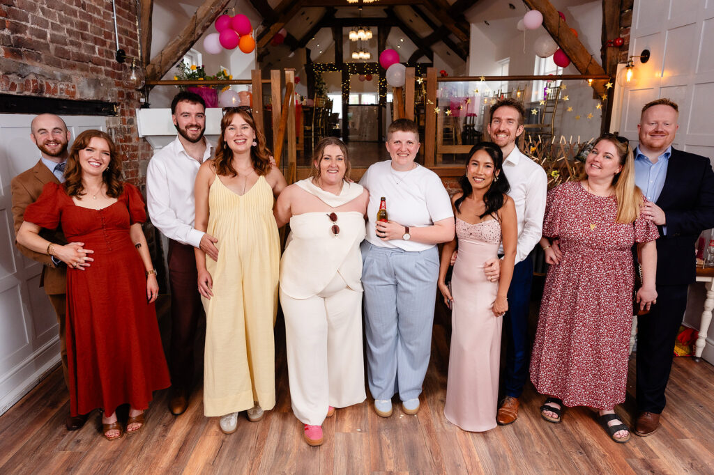 Friends group photo with Marianne and Emma under the beams at The Hidden Barn @ 94